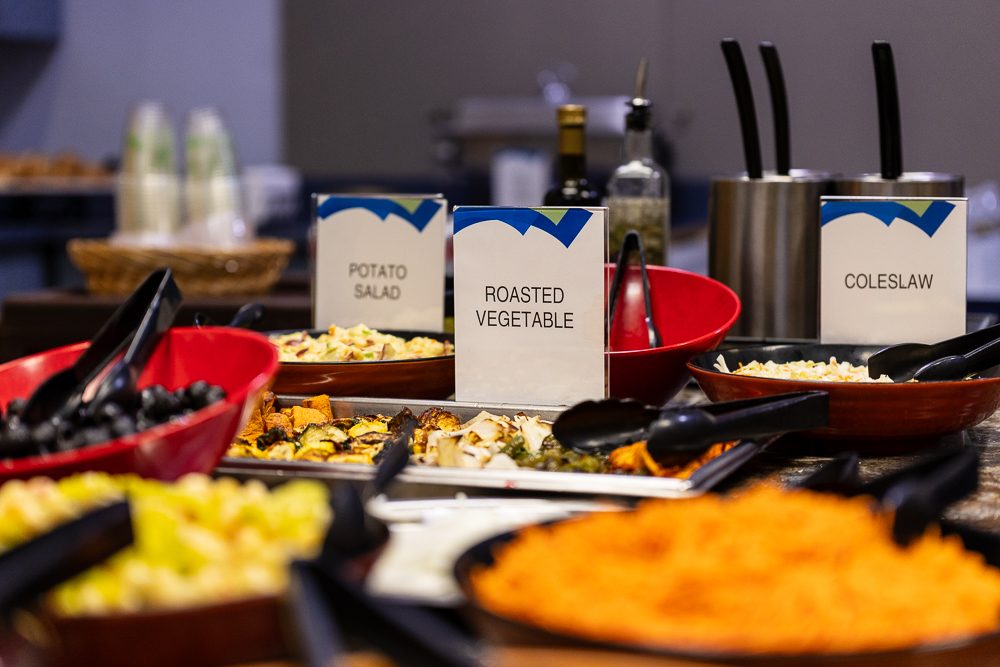 In-house catering buffet with salads and hot entrees